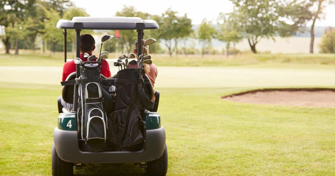 rear-view-of-couple-playing-golf-driving-buggy-alo-2023-11-27-04-54-14-utc-min